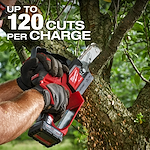 A person using the M12 FUEL™ HATCHET™ 6" Pruning Saw to cut a tree branch. The text on the image states "UP TO 120 CUTS PER CHARGE." The tool is red and black with sawdust visible as the cut is made.