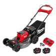 A red and gray Milwaukee cordless electric lawn mower is shown with a grass collection bag attached at the rear. The set includes two M18 REDLITHIUM HD12.0 battery packs and a dual-bay rapid charger. The mower has a sturdy build with red and black handlebars.