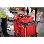 Man putting the PACKOUT Tool Tray inside of the PACKOUT Crate