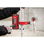 Worker using the rotary laser receiver and receiver clamp