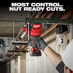 A person wearing work gloves and a hard hat uses a Milwaukee Brushless power tool to cut a metal beam. The image highlights the tool's ability to make precise cuts, as suggested by the text, "MOST CONTROL. NUT READY CUTS."