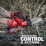 A person using the M12 FUEL™ HATCHET™ 6" Pruning Saw to cut through branches at the base of a shrub. The tool is red with a black handle and has “Milwaukee” branding. The text "UNMATCHED CONTROL & ACCESS" appears at the bottom.