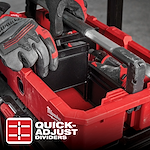 A person wearing gloves adjusts a divider inside a red storage box labeled "App%20Shot%20Overlay" with the text "Quick-Adjust Dividers".