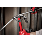 1/2" EMT Iron Conduit Bender with red handle, used by a person wearing red work gloves to bend conduit pipe in a construction setting.