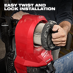 A person installs a Milwaukee Fuel HEPA Filter with a twist and lock mechanism. The HEPA Filter is shown inside a red casing with branding visible. The caption "Easy twist and lock installation" is displayed at the top of the image.
