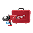 The M18™ FORCE LOGIC™ 750 MCM Crimper w/ #6 - 750 MCM Al Dies Kit is a red handheld electrical tool designed for crimping aluminum wires. It is shown with a matching red storage case displaying Milwaukee branding on the front. The tool features an ergonomic handle and connectivity symbol.
