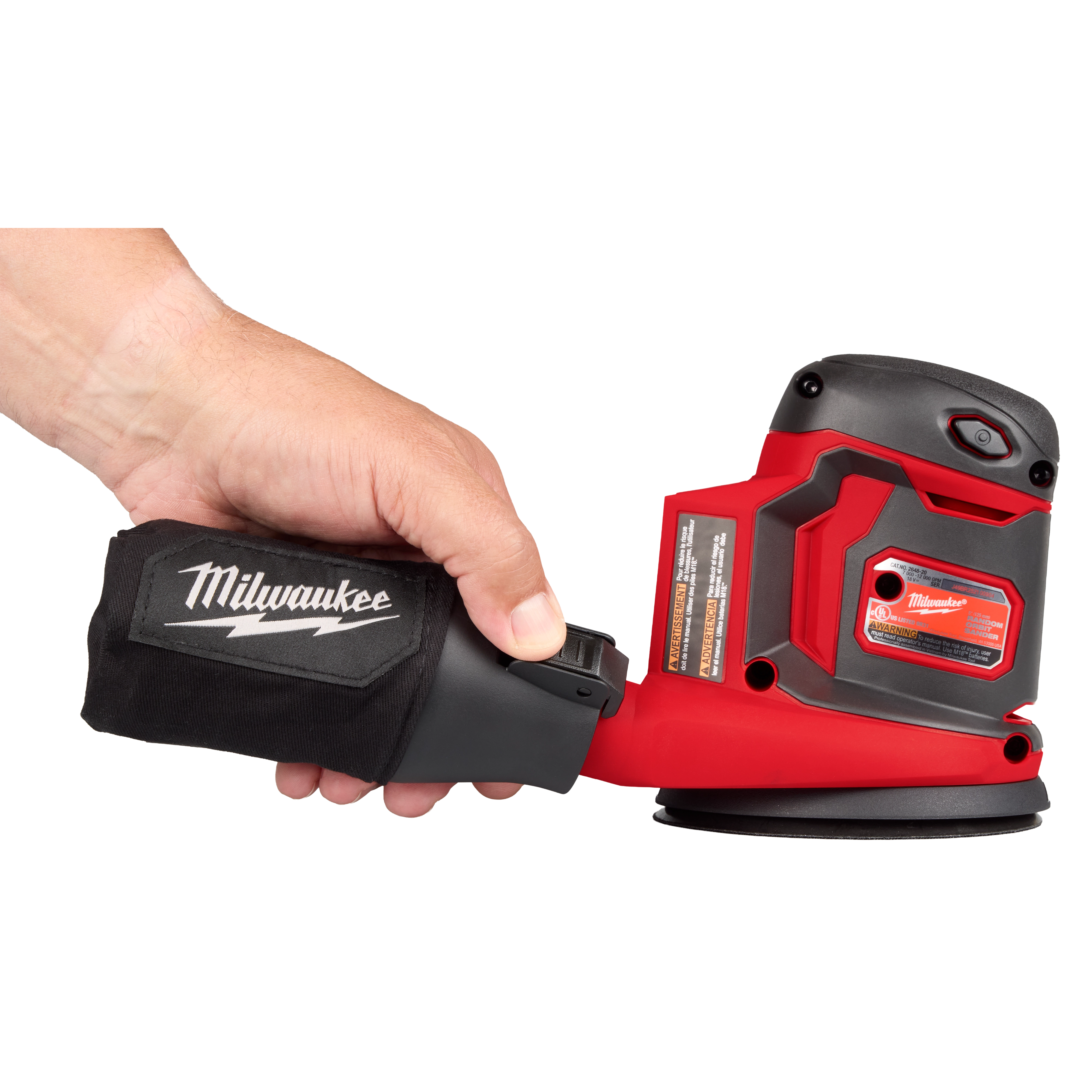A person holds a Milwaukee M18™ Random Orbit Sander by its dust collection bag. The sander is red and black with a black branded bag. The image displays the sander's side profile with visible control buttons and branding.