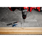 7pc. SHOCKWAVE Impact Duty Carbide Multi-Material Drill Bit Concrete Screw Install Kit being used to drill into a wooden plank.