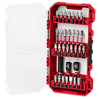 A Milwaukee tool set in a red case with a clear lid. It contains multiple screwdriver bits arranged in rows, along with adapters and extensions held securely in place. The lid features a faint Milwaukee logo.